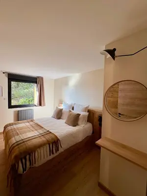 Un ou plusieurs lits dans un hébergement de l'établissement Chalet Cimebleu SPA & Sauna