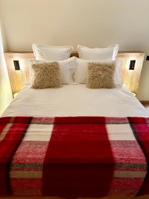 Un ou plusieurs lits dans un hébergement de l'établissement Chalet Cimebleu SPA & Sauna