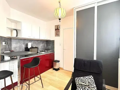 Cuisine ou kitchenette dans l'établissement Appartement élégant et fonctionnel