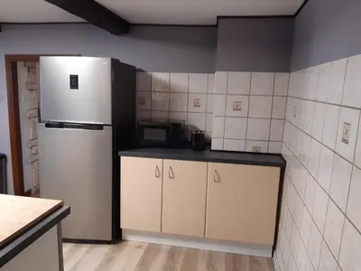 Cuisine ou kitchenette dans l'établissement appartement de vacances