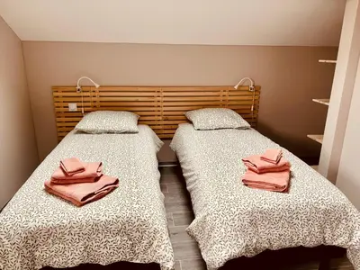 Un ou plusieurs lits dans un hébergement de l'établissement Très joli logement
