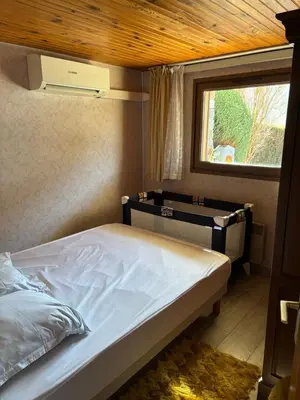 Un ou plusieurs lits dans un hébergement de l'établissement Appartement typique 3 pièces - La Bresse