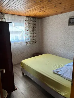 Un ou plusieurs lits dans un hébergement de l'établissement Appartement typique 3 pièces - La Bresse