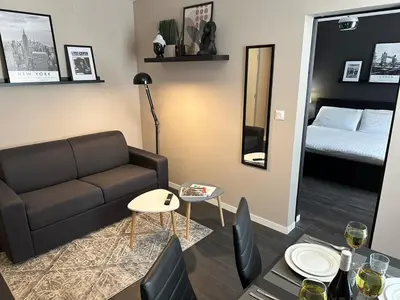 Coin salon dans l'établissement Appartement le Gilia
