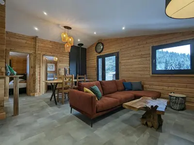Coin salon dans l'établissement Chalet rénové avec sauna, proche Gérardmer - FR-1-589-796