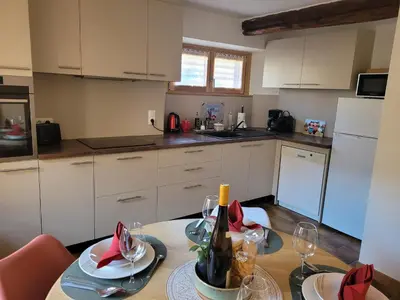 Cuisine ou kitchenette dans l'établissement Au gré des Saisons - côté terrasse