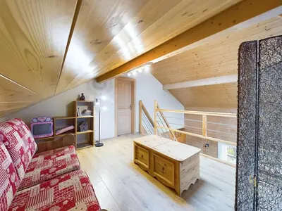 Coin salon dans l'établissement Chalet La Perle Blanche - Spa, Baby-foot, Terrasse