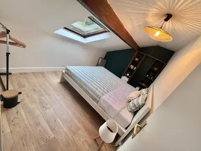 Un ou plusieurs lits dans un hébergement de l'établissement Cosy et Bel Appart paisible