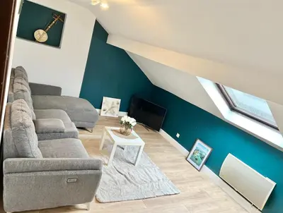 Coin salon dans l'établissement Cosy et Bel Appart paisible