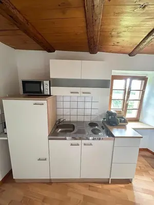 Cuisine ou kitchenette dans l'établissement Cocon du Vignoble