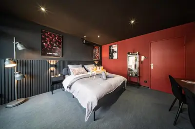 Un ou plusieurs lits dans un hébergement de l'établissement Home Studio Cinéma Privé