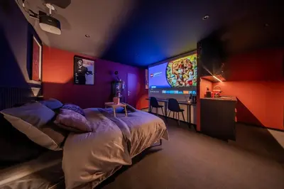 Un ou plusieurs lits dans un hébergement de l'établissement Home Studio Cinéma Privé