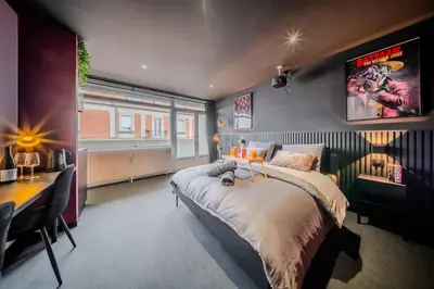 Un ou plusieurs lits dans un hébergement de l'établissement Home Studio Cinéma Privé