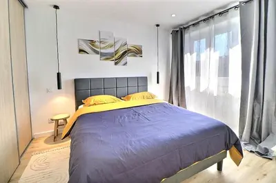 Un ou plusieurs lits dans un hébergement de l'établissement Appartement Moderne et Cosy avec Balcon - Parking Gratuit - Netflix