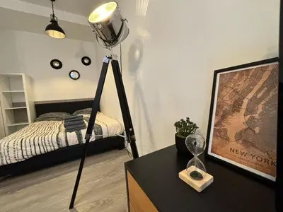 Un ou plusieurs lits dans un hébergement de l'établissement L'Atelier Urbain Apartment