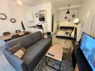 Coin salon dans l'établissement L'Atelier Urbain Apartment
