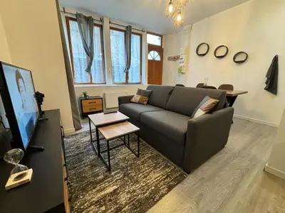 Télévision ou salle de divertissement dans l'établissement L'Atelier Urbain Apartment