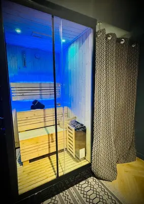Un ou plusieurs lits dans un hébergement de l'établissement Suite Richovilare - Sauna & Hammam