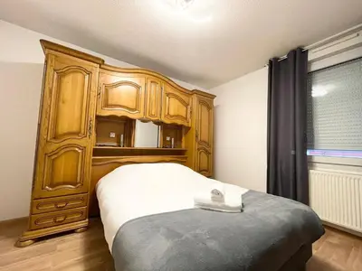 Un ou plusieurs lits dans un hébergement de l'établissement Le Fleur Magnifique Appartement Saint-Louis