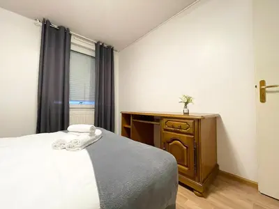 Un ou plusieurs lits dans un hébergement de l'établissement Le Fleur Magnifique Appartement Saint-Louis