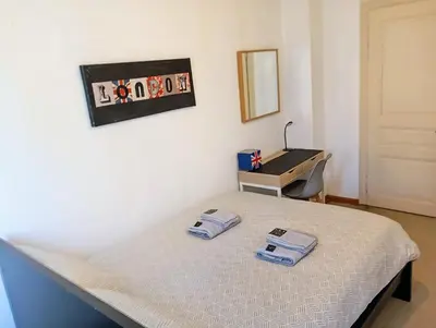 Un ou plusieurs lits dans un hébergement de l'établissement Chez Jimmy London