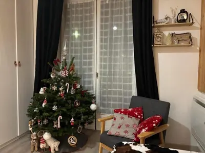 Coin salon dans l'établissement Appartement La Bresse