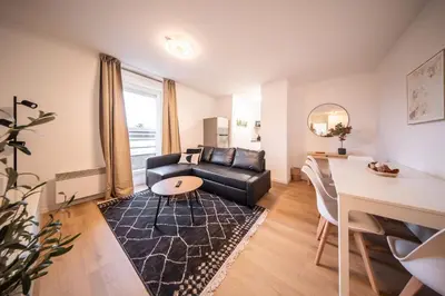 Coin salon dans l'établissement Le Bâle 92A Appartement 6 Pers Parking Privé