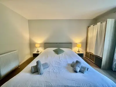 Un ou plusieurs lits dans un hébergement de l'établissement Le Duplex Géromois, beautiful apartment & city center
