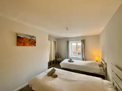Un ou plusieurs lits dans un hébergement de l'établissement Le Duplex Géromois, beautiful apartment & city center