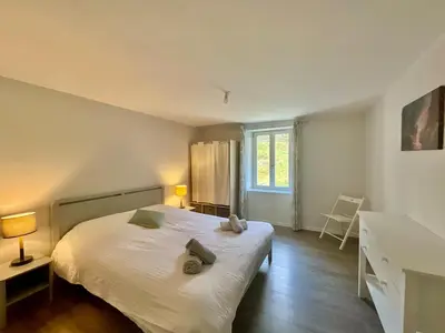 Un ou plusieurs lits dans un hébergement de l'établissement Le Duplex Géromois, beautiful apartment & city center