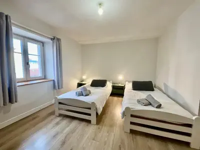 Un ou plusieurs lits dans un hébergement de l'établissement La Roche du Rain, bel appartement & centre-ville