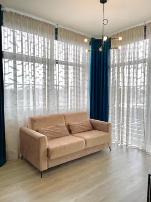Coin salon dans l'établissement Logement Émeraude