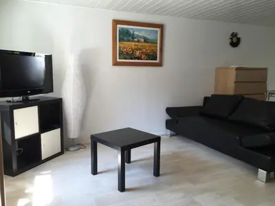 Télévision ou salle de divertissement dans l'établissement Appartement proche Colmar