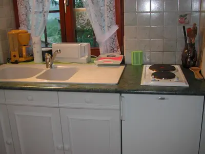 Cuisine ou kitchenette dans l'établissement Studio CHAMPETRE F1