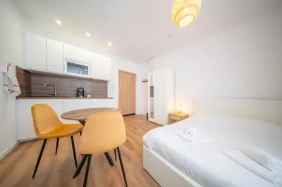 Un ou plusieurs lits dans un hébergement de l'établissement Frontiere Suites 4 Saint-Louis Proche Bale