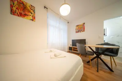 Un ou plusieurs lits dans un hébergement de l'établissement Frontiere Suites 2 Saint-Louis Proche Bale