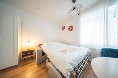 Un ou plusieurs lits dans un hébergement de l'établissement Frontiere Suites 6 Saint-Louis Proche Bale