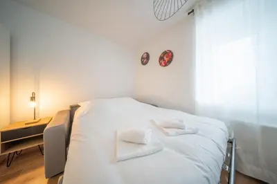 Un ou plusieurs lits dans un hébergement de l'établissement Frontiere Suites 6 Saint-Louis Proche Bale