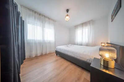 Un ou plusieurs lits dans un hébergement de l'établissement Frontiere Suites 7 Saint-Louis Proche Bale