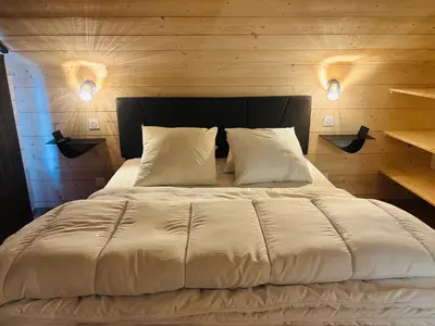 Un ou plusieurs lits dans un hébergement de l'établissement Chalet Abies Alba