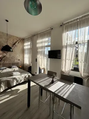 Télévision ou salle de divertissement dans l'établissement Studio Sylvinite
