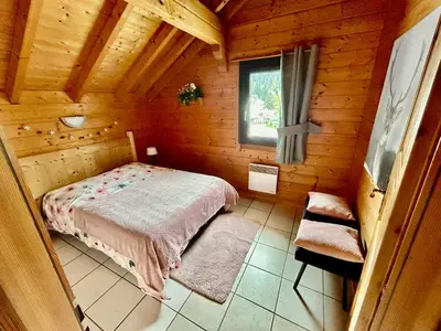 Un ou plusieurs lits dans un hébergement de l'établissement Chalet Le Roncing