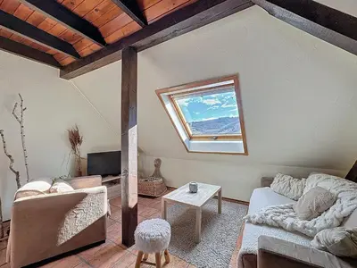 Coin salon dans l'établissement La Belle Étape, Appartement avec Piscine et Spa