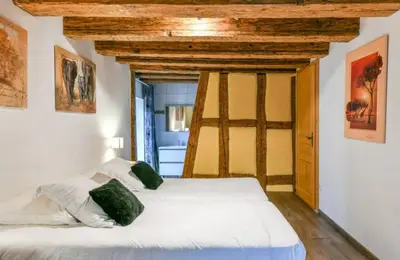 Un ou plusieurs lits dans un hébergement de l'établissement Gite de la Porte des Pucelles