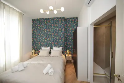 Un ou plusieurs lits dans un hébergement de l'établissement LE LYNX HAUSSMANIEN appartement tout confort, climatisé avec parking privé, à deux pas du centre