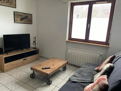 Télévision ou salle de divertissement dans l'établissement Au petit Bretzel