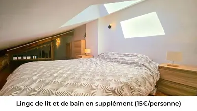Un ou plusieurs lits dans un hébergement de l'établissement f2 VUE INCROYABLe sur lac avec jardin avec balnéo et 400m centre