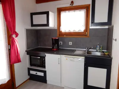 Cuisine ou kitchenette dans l'établissement Chalet des FURETS