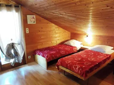 Un ou plusieurs lits dans un hébergement de l'établissement Chalet des FURETS