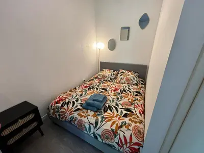 Un ou plusieurs lits dans un hébergement de l'établissement Le Salon Doré Apartment